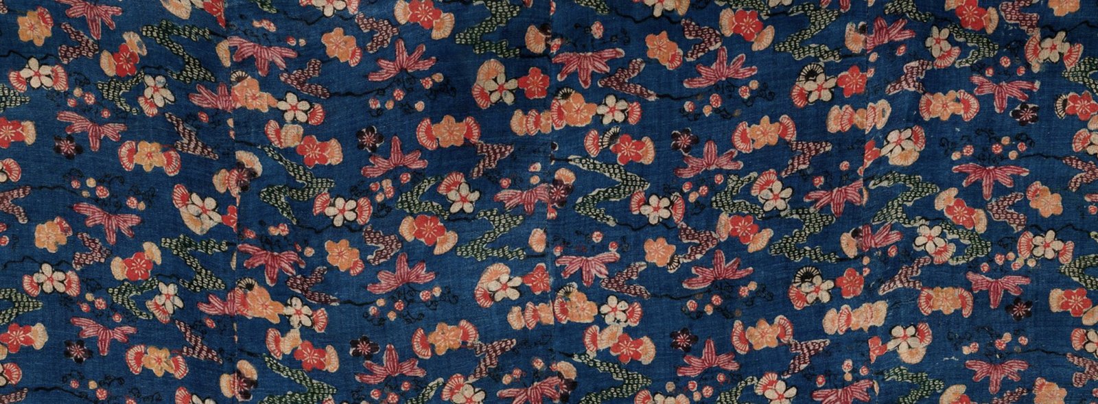 Detail of a 19th-century blue bingata kimono with floral motifs