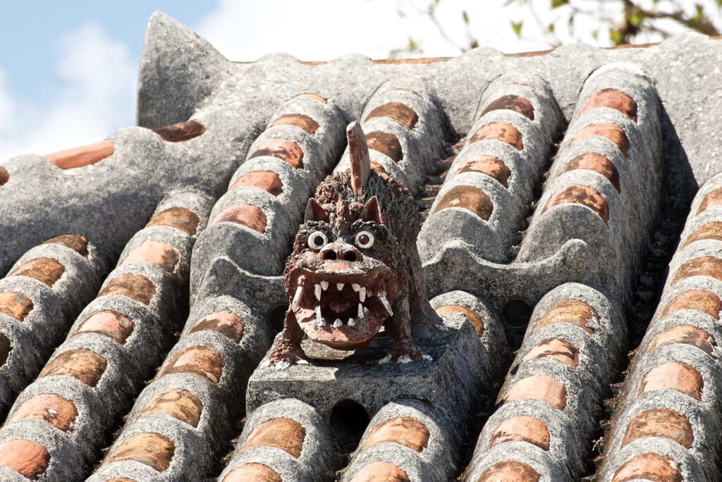 Shisa on a red-tiled roof on Taketomi Island