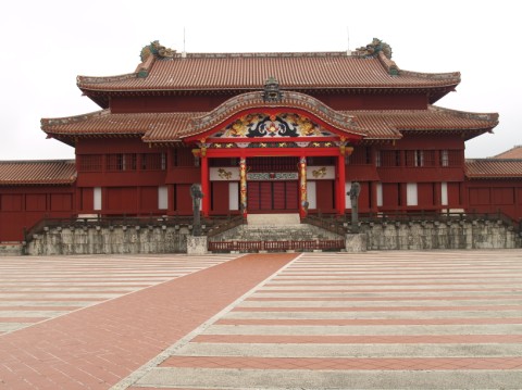 The red main hall of Shuri Castle facing its striped courtyard, as it stood before the 2019 fire